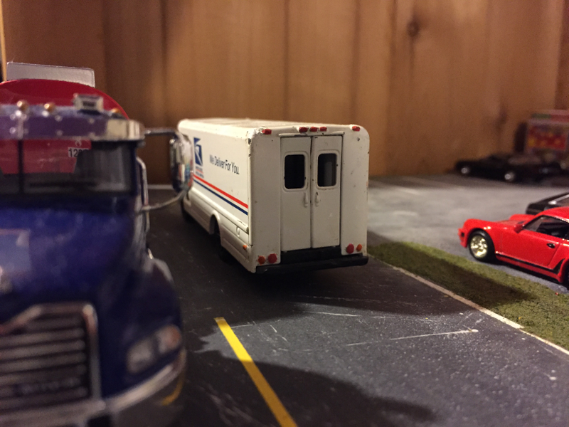 The mail truck out delivering mail.